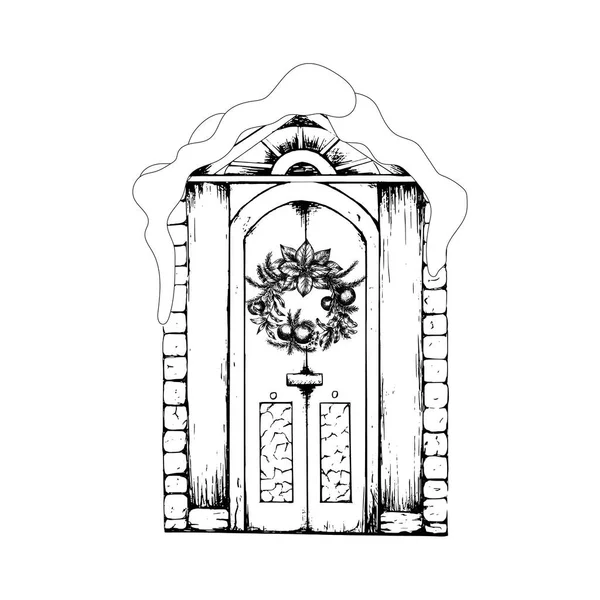 El yapımı klasik kapı. Kapalı kar girişi karla kaplı. Noel çelengi..