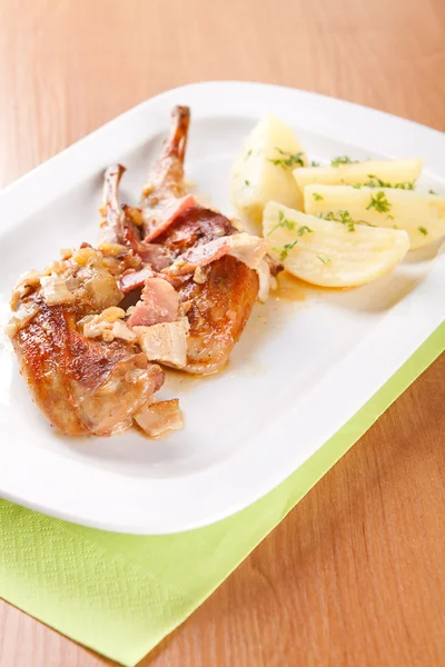 Marinated rabbit with bacon and boiled potatoes — Stock Photo, Image