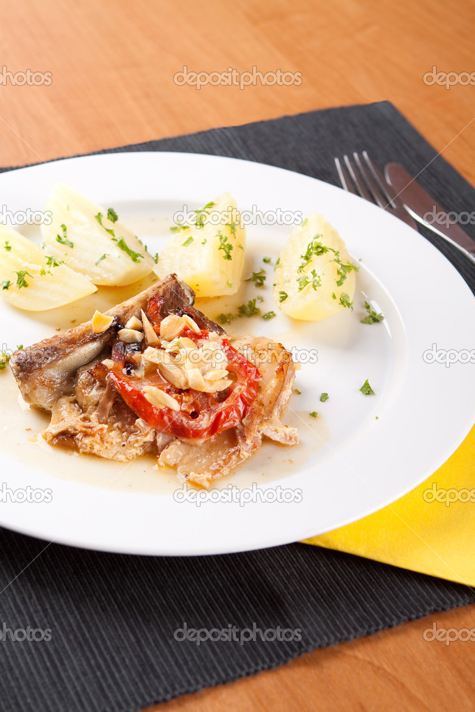 Rib with ham and almonds with boiled potatoes