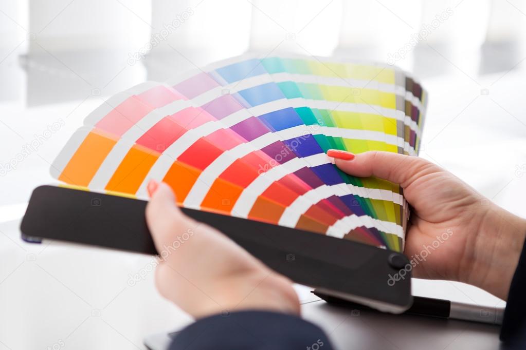 Graphic designer working with pantone palette