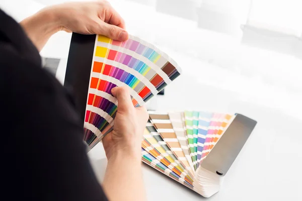 Graphic designer working with pantone palette — Stock Photo, Image