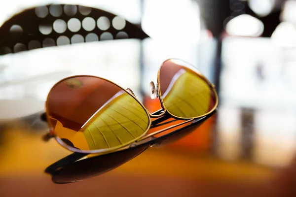 Sunglasses on the table — Stock Photo, Image