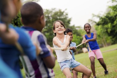 group of happy multi ethnic school kids playing