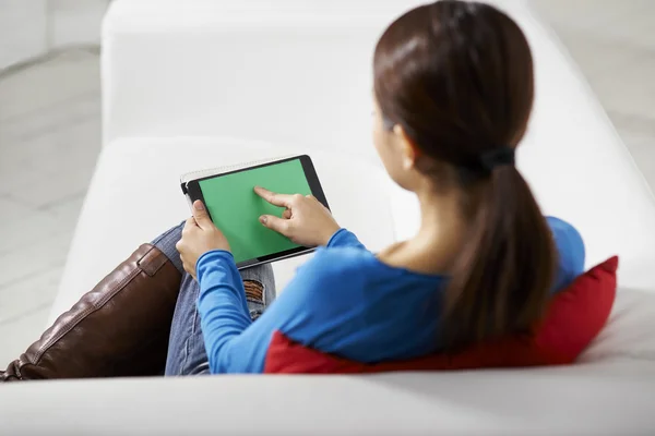 Asian girl using touch pad device — Stock Photo, Image