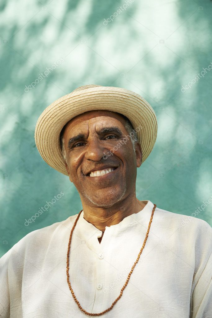 Portrait of senior hispanic man smiling at camera