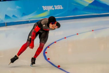 11 Şubat 2022 - Pekin, Hebei, CHN: Graeme FISH (CAN) Pekin, Hebei, Çin 'de düzenlenen 2022 Kış Olimpiyatları sırasında Ulusal Hız Pateni Oval Şampiyonası' nda 100.000 metre sürat pateni müsabakasında yarışmıştır.. 