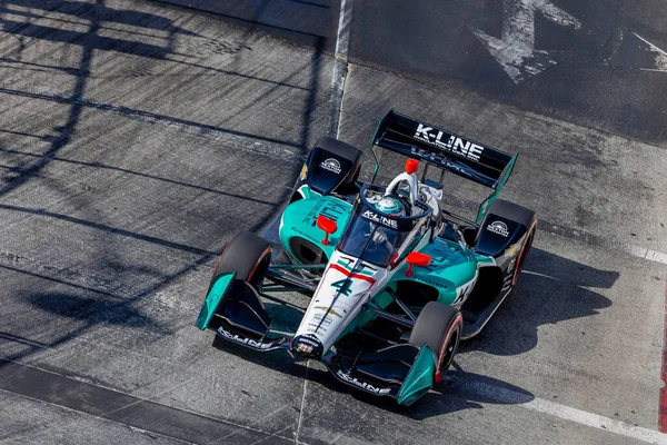 Stouffville, Kanada 'dan DALTON KELLETT (4), Long Beach, Kaliforniya' daki Long Beach Caddeleri 'nde düzenlenen Acura Grand Prix antrenmanı sırasında virajlarda koşuyor..