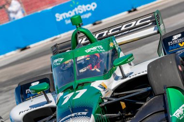 Cambridge, İngiltere 'den CALLUM LLOTT (77) (R) Toronto' daki Toronto Caddeleri Sergisi 'nde Honda Indy Toronto için yapılan bir çalışma sırasında virajlardan geçer..