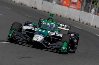 Cambridge, İngiltere 'den CALLUM LLOTT (77) (R) Toronto' daki Toronto Caddeleri Sergisi 'nde Honda Indy Toronto için yapılan bir çalışma sırasında virajlardan geçer..