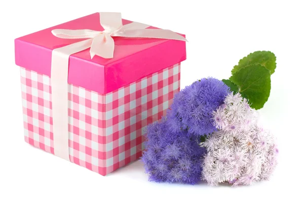 Gift box and bunch of flowers — Stock Photo, Image