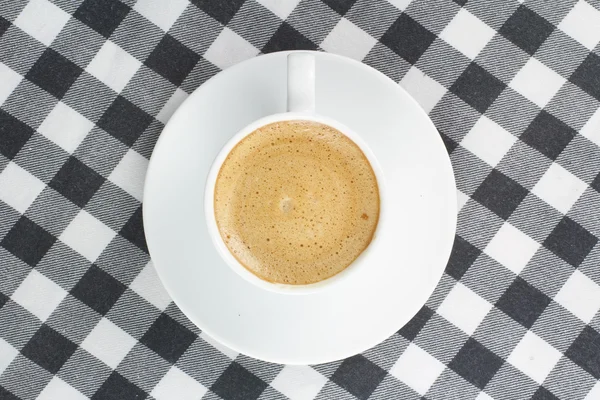 Káva v pohledu shora kostkovaný ubrus — Stock fotografie