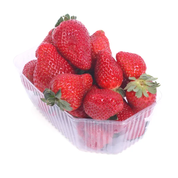 Fresh juicy strawberries in a plastic box isolated on white — Stock Photo, Image