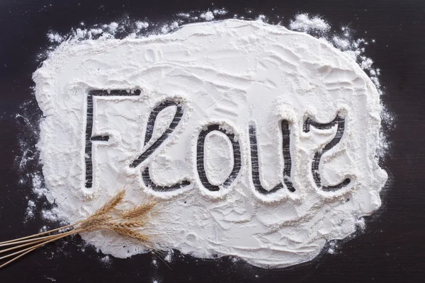 The inscription on the flour , decorating wheat — Stock Photo, Image