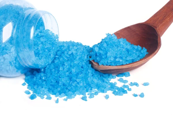 Blue bath salt in a glass jar and a wooden spoon isolated — Stock Photo, Image