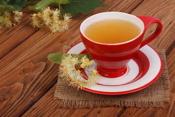 Herbal tea with a linden on a napkin in a rustic style — Stock Photo, Image