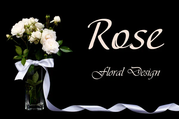 Festive bouquet of white roses in a vase with a bow on a black — Stock Photo, Image