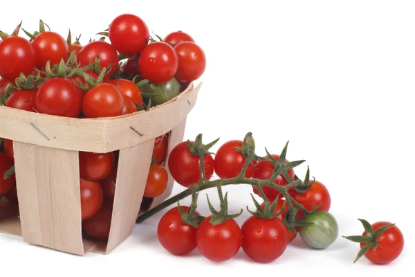 Wooden container with cherry tomatoes isolated on white — Stock Photo, Image