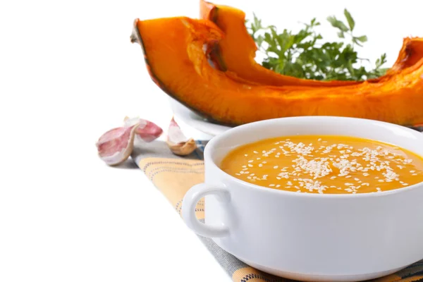 Pumpkin cream soup with sesame seeds isolated on white — Stock Photo, Image