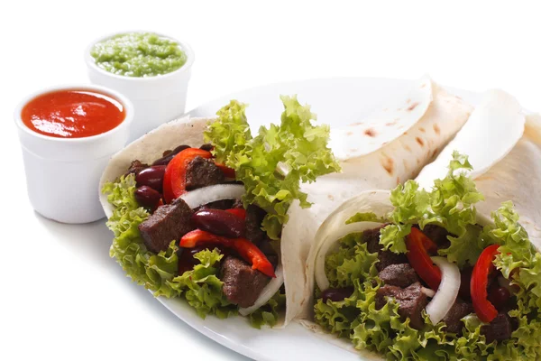 Two burritos with meat and vegetables and sauce isolated — Stock Photo, Image