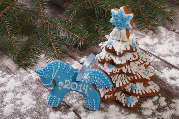 Blue horse cookies and gingerbread Christmas tree — Stock Photo, Image
