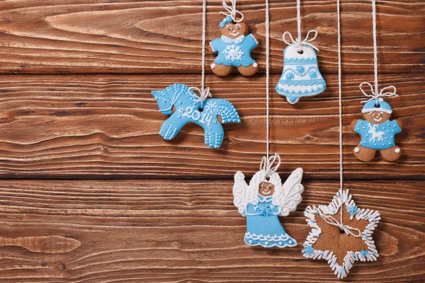 Christmas gingerbread hanging on the ropes — Stock Photo, Image