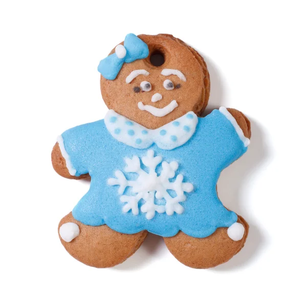 Gingerbread man. Girl with bow in blue coat with snowflake — Stock Photo, Image