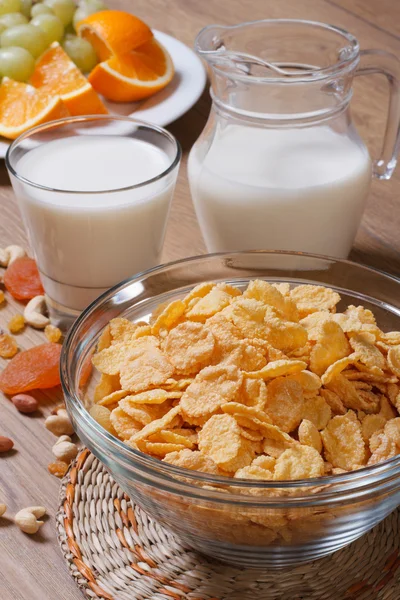Cornflakes with milk and dried fruit. vertical — Stock Photo, Image