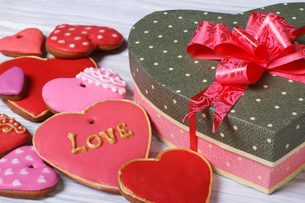 Festive box with a bow and colorful biscuit hearts for Valentine — Stock Photo, Image