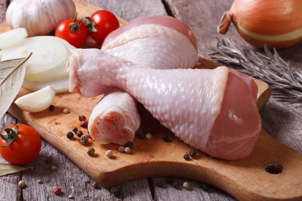 Raw chicken legs and marinade ingredients — Stock Photo, Image