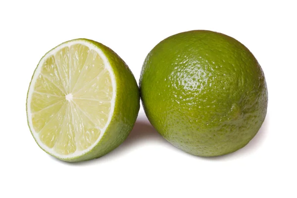 Whole and half fresh lime isolated on white background — Stock Photo, Image