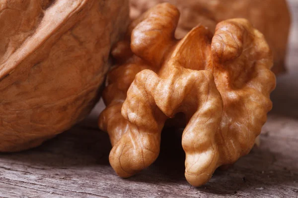 Walnut kernel macro on a wooden table — Stock Photo, Image