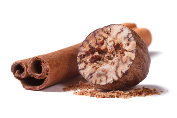 Nutmeg and cinnamon stick isolated — Stock Photo, Image