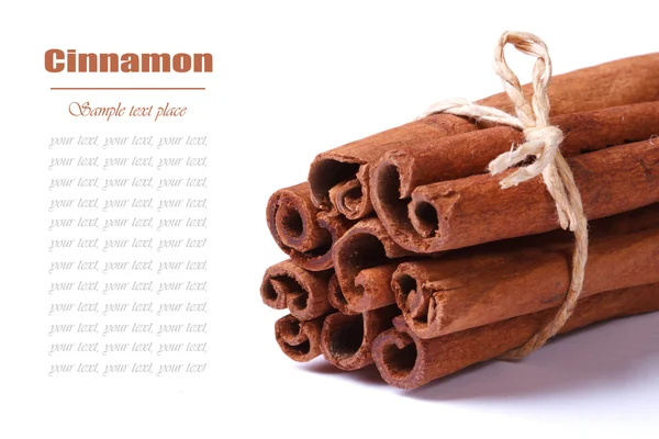 Bunch of cinnamon sticks closeup isolated on white — Stock Photo, Image