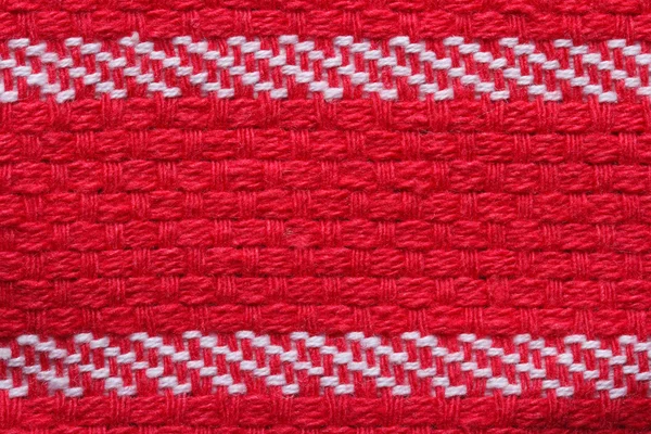 Tekstury bawełna czerwony ręcznik kuchenny z białymi paskami. makro. — Zdjęcie stockowe