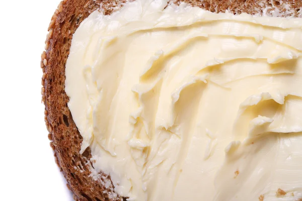 Pane con burro da vicino isolato su fondo bianco. macro — Foto Stock