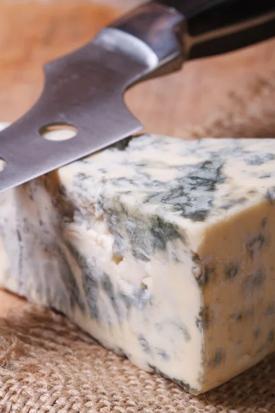 Blue cheese Dorblu closeup on a kitchen wooden board — Stock Photo, Image