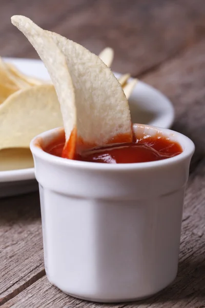 Potato chips with ketchup macro for close up old desk — Stock Photo, Image