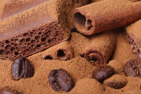 Porous chocolate and ground coffee and beans, cinnamon closeup — Stock Photo, Image