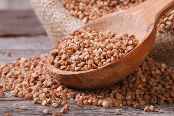 Buckwheat sprinkled on the table. horizontal. macro — Stock Photo, Image