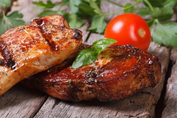 Two slices of juicy grilled meat with basil — Stock Photo, Image
