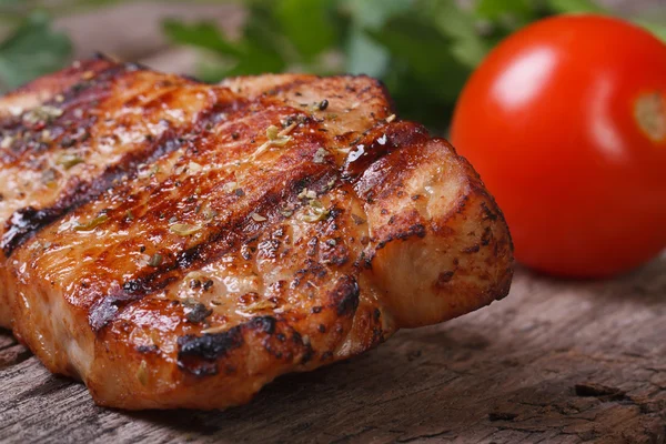 Juicy piece of grilled meat with tomato — Stock Photo, Image