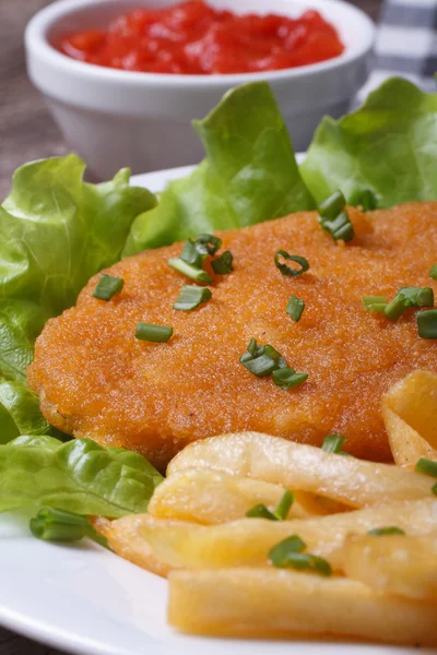 French fries and schnitzel closeup. Vertical — Stock Photo, Image