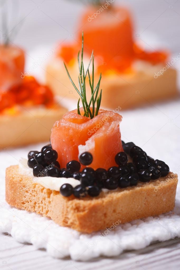 Canapes with black sturgeon caviar, smoked salmon and dill