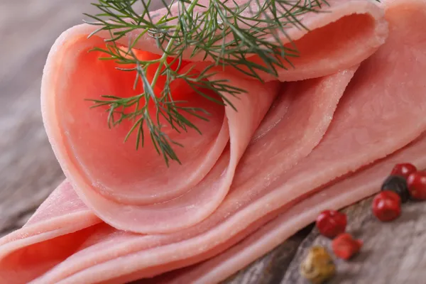 Rolled ham close up with dill and spices — Stock Photo, Image