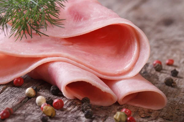 Ham macro on an old table with dill — Stock Photo, Image