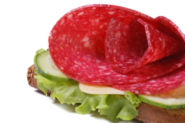 Sandwich with salami, cheese and cucumbers isolated — Stock Photo, Image
