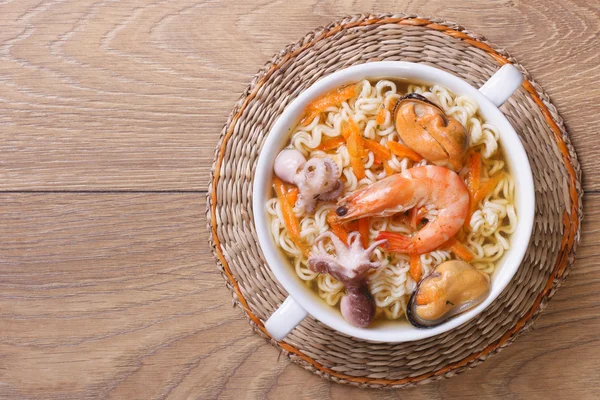 Soup from seafood with the Chinese noodles. top view — Stock Image Soup from seafood with the Chinese noodles. top view Stock Photo