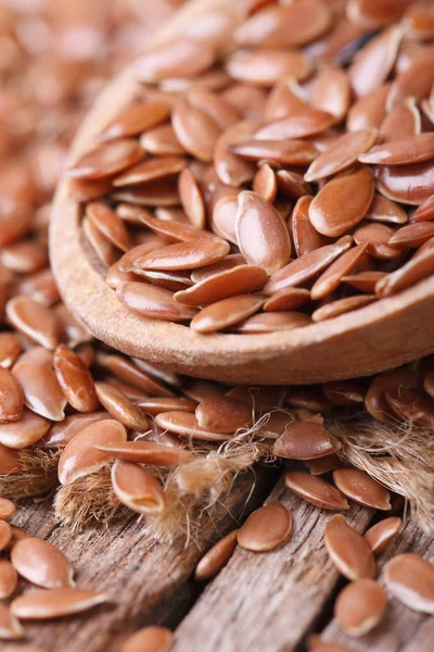 Flax seeds close up in a wooden spoon. — Stock Photo, Image