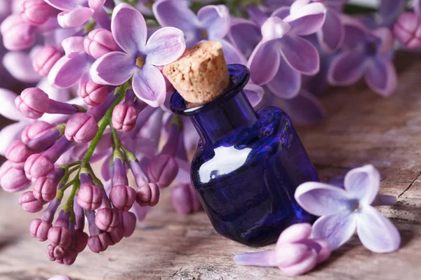 Massage oil from fragrant lilac flowers macro — Stock Photo, Image