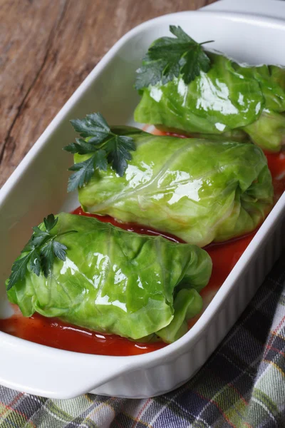 Cabbage rolls with meat and sauce on a dish — Stock Photo, Image